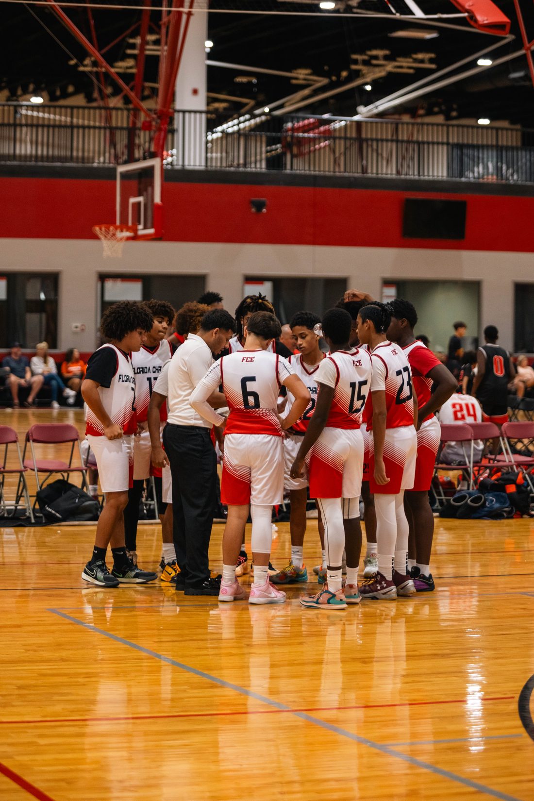 FCE team huddle with coach